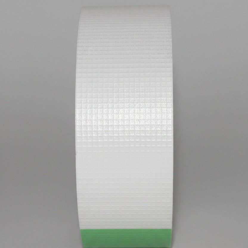 E&H 753-MP close-up of dull gray metalized PEEK film surface showing 10×10 visual scrim grid pattern