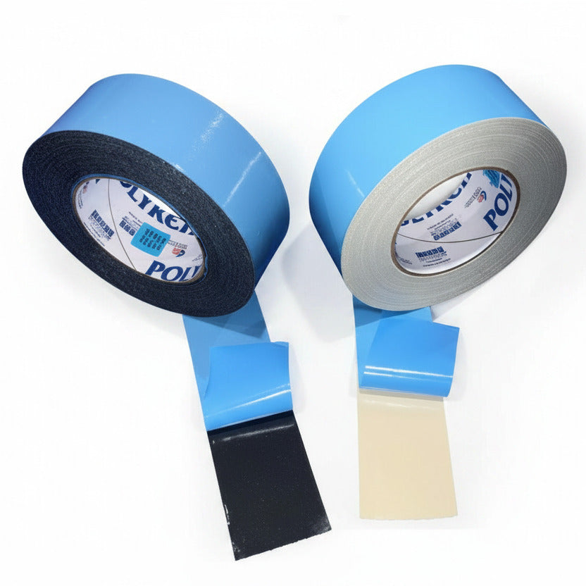 Polyken 108FR close-up showing black cloth backing and beige natural cloth backing with blue LDPE liner